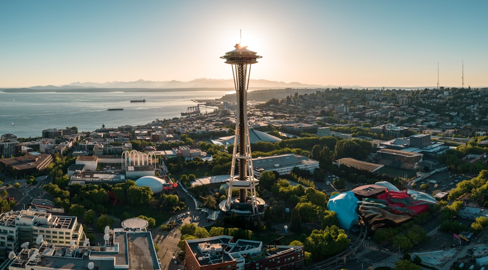 a view of a city with a tower in the middle of it