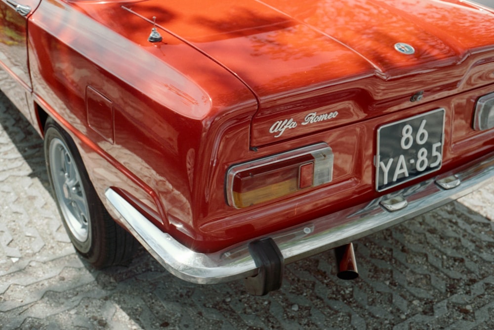 a red car parked on the side of the road