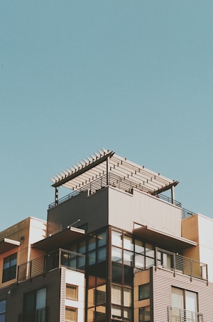 a tall building with a clock on the top of it
