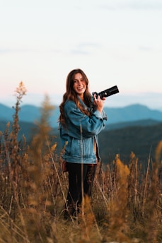 a woman taking a picture with a camera