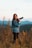 a woman taking a picture with a camera