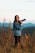 a woman taking a picture with a camera