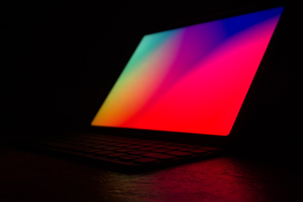 a close up of a laptop in a dark room