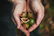Close-up of a happy customer holding a bag of premium natural nuts from Nueces Noble.