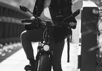 man in black jacket riding motorcycle