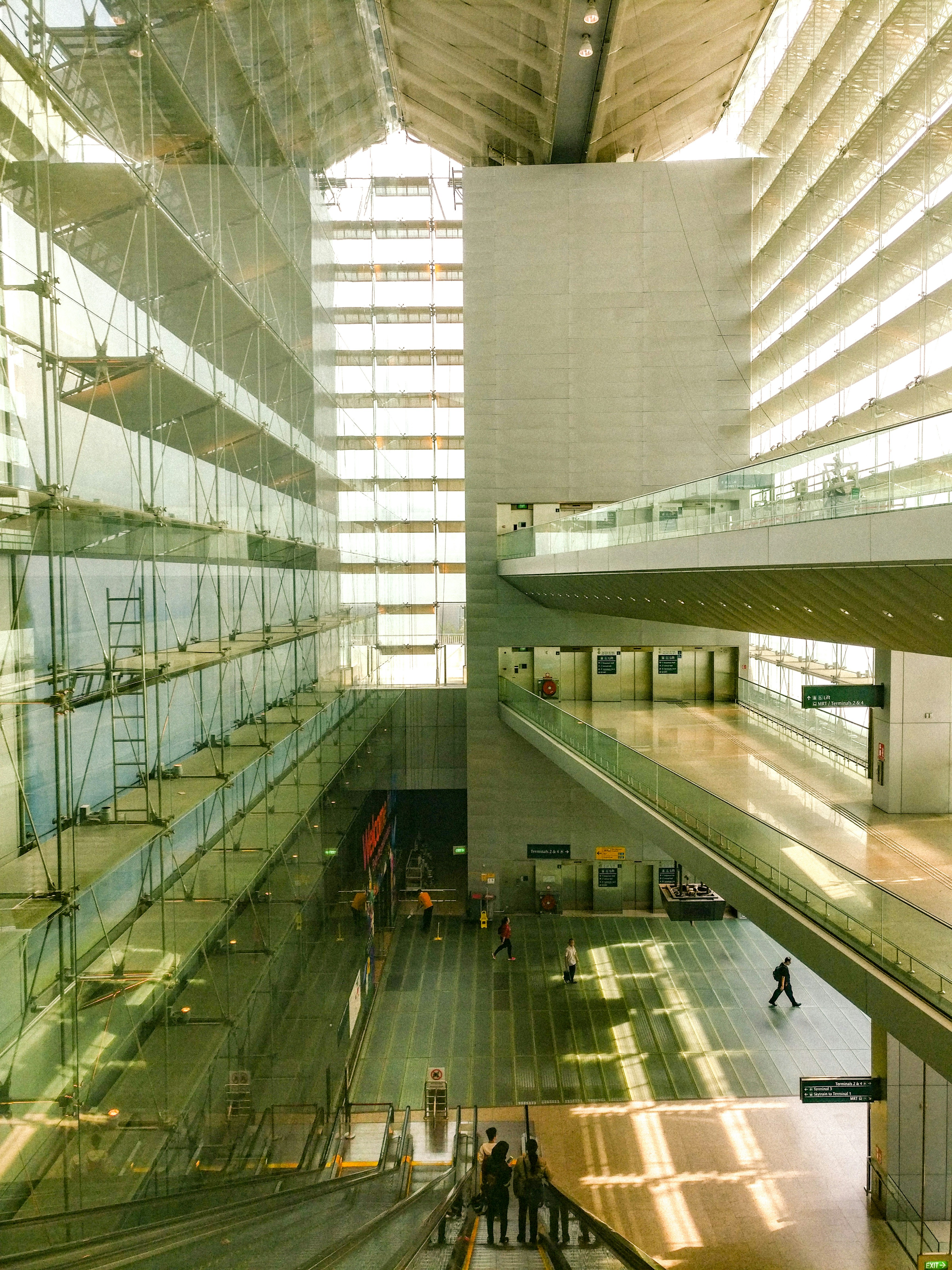 Airport terminal interior with bright natural light and departure gates