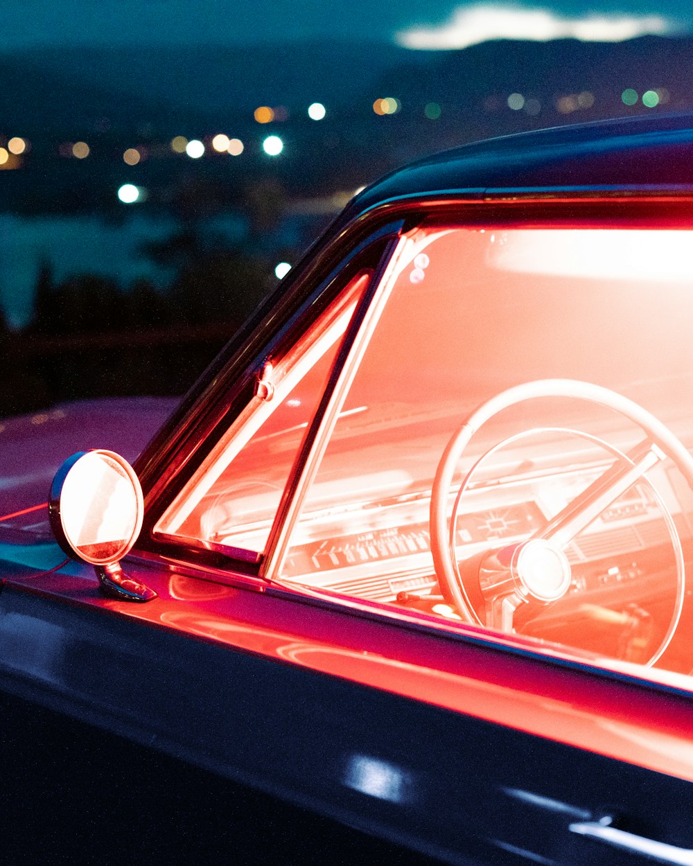 red car with white steering wheel