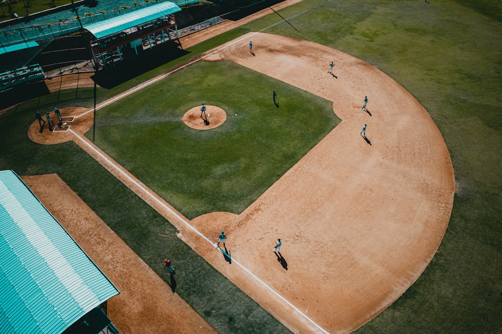 people playing basketball on brown field during daytime