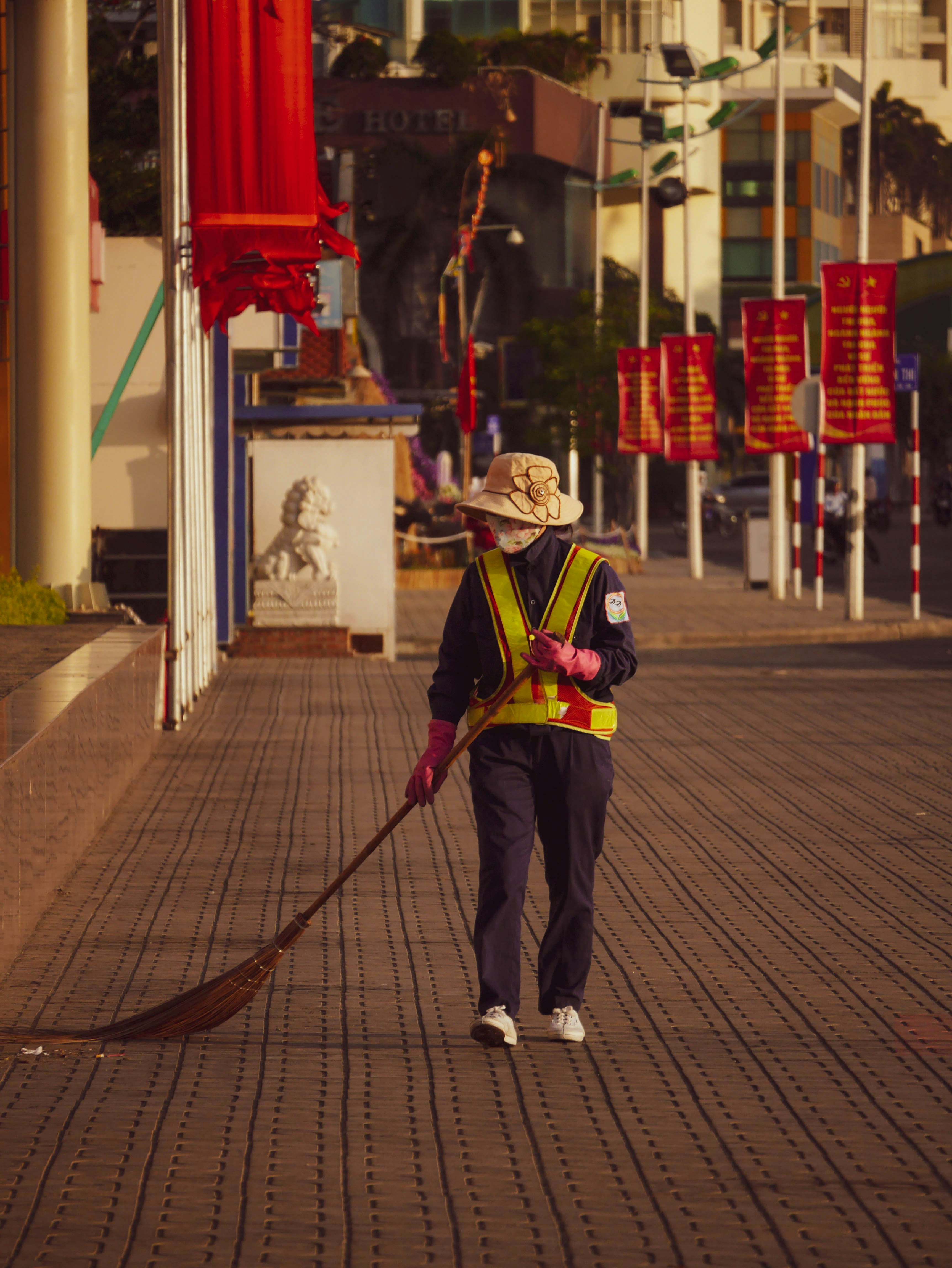 man in black jacket and pants holding walking stick