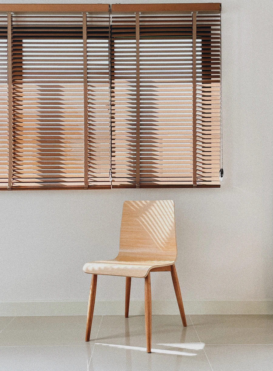 Wooden chair against a white wall