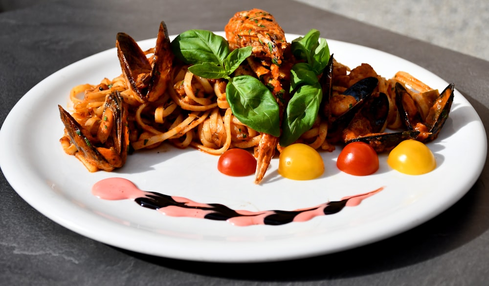 pasta with sauce on white ceramic plate