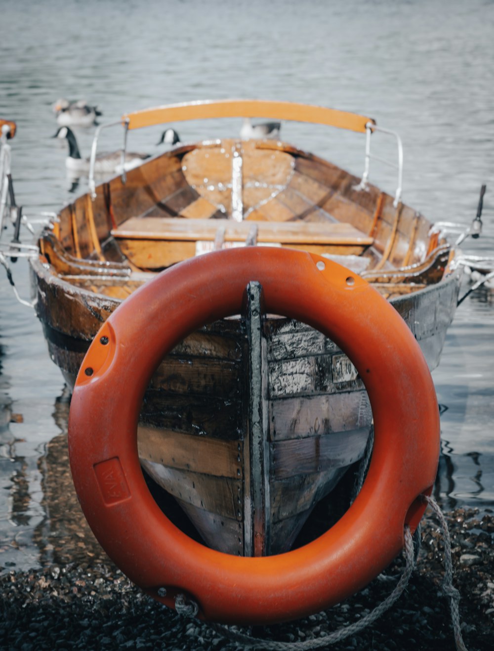 orange and white boat on water