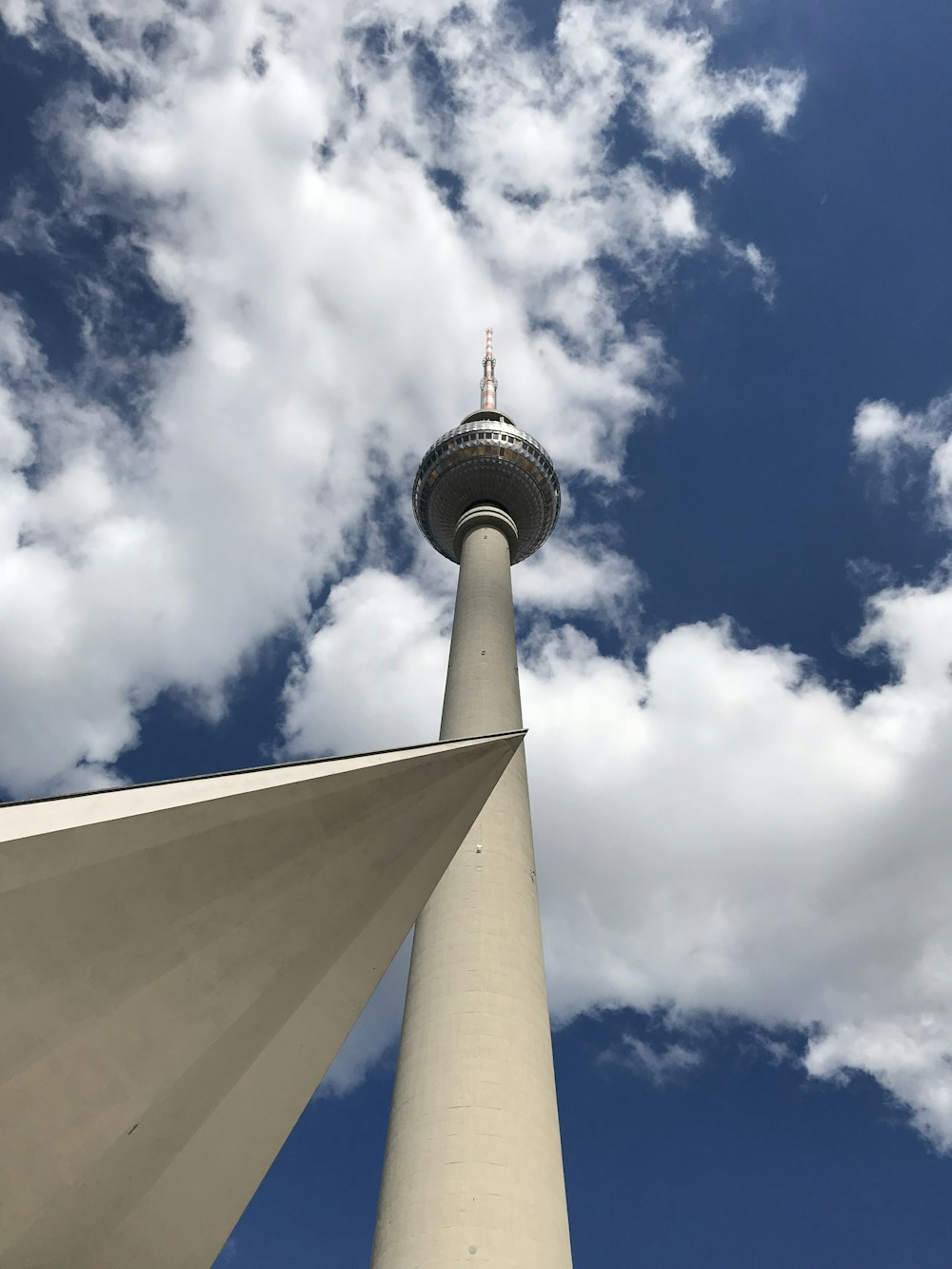 white and red tower under blue sky