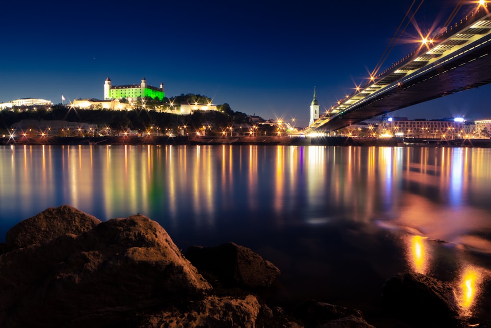 body of water near bridge during night time