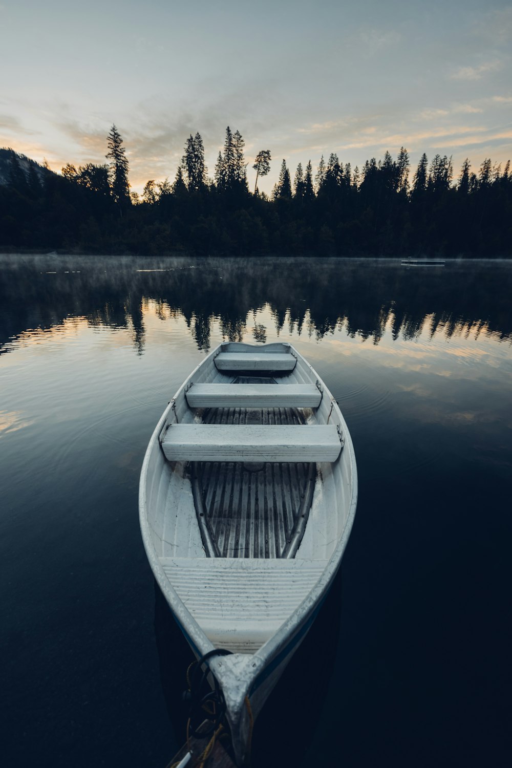 white boat on lake during daytime