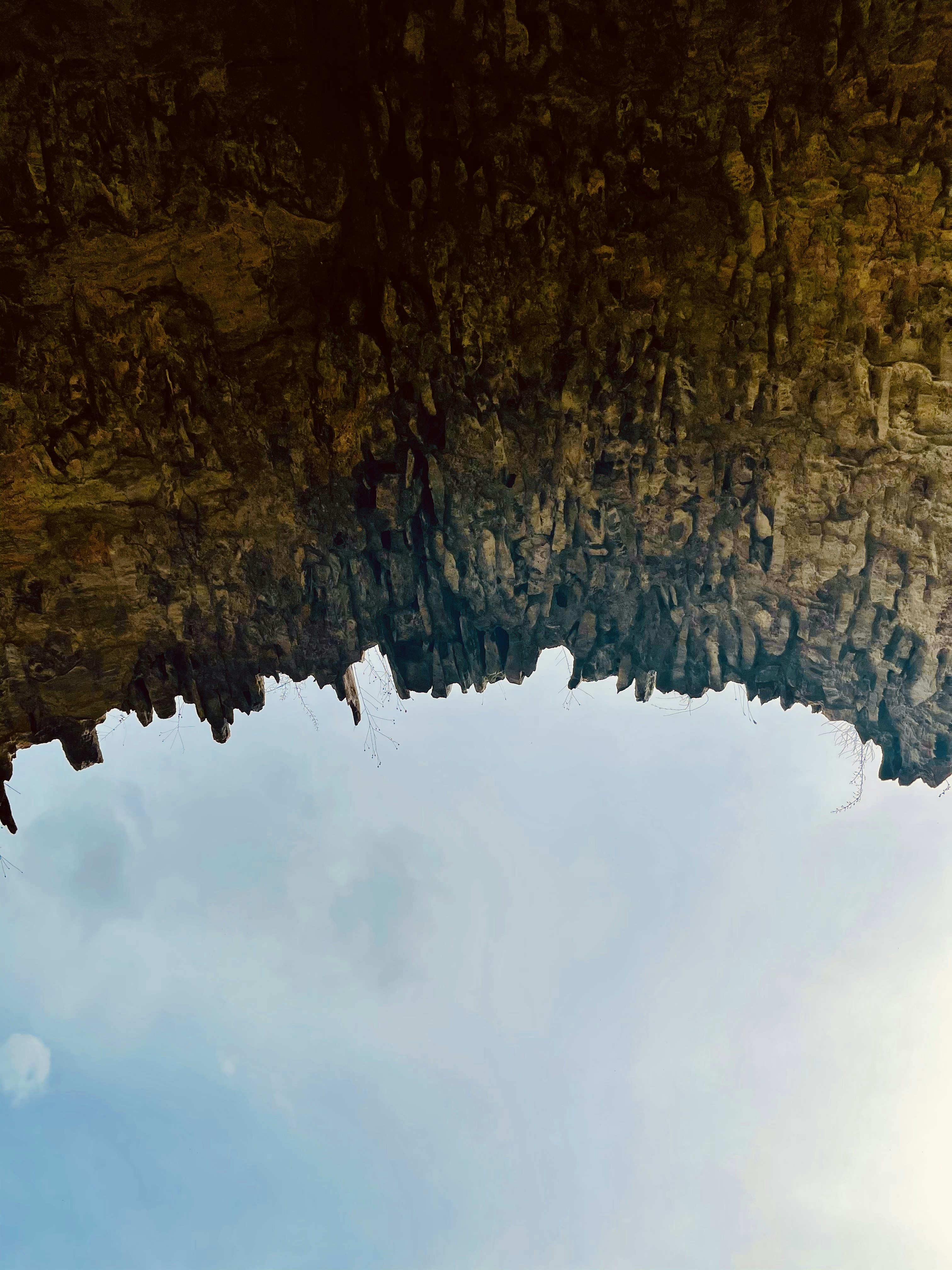 brown and green mountain under white clouds