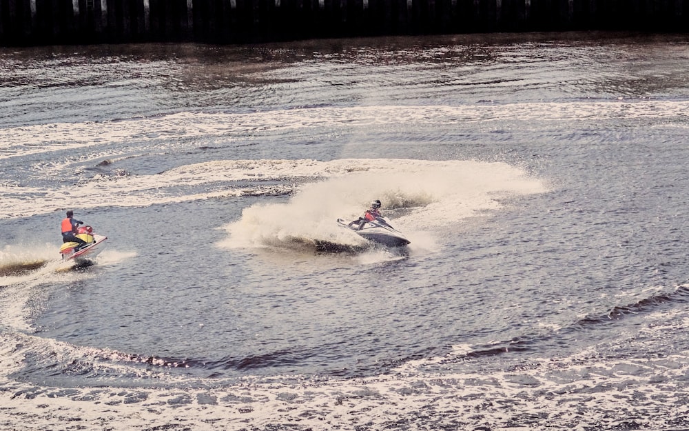 person surfing on sea waves during daytime