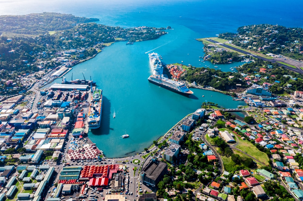 aerial view of city buildings near body of water during daytime