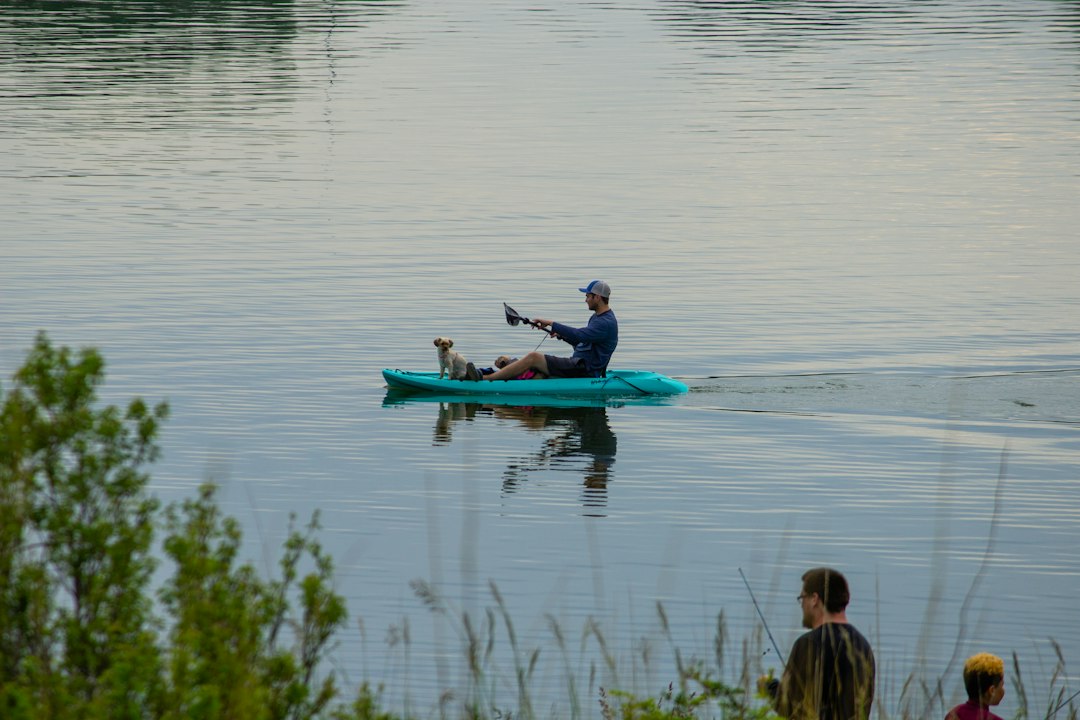 People enjoying recreational activities like boating or fishing on a reservoir - benefits of hydropower plant People enjoying recreational activities like boating or fishing on a reservoir - benefits of hydropower plant