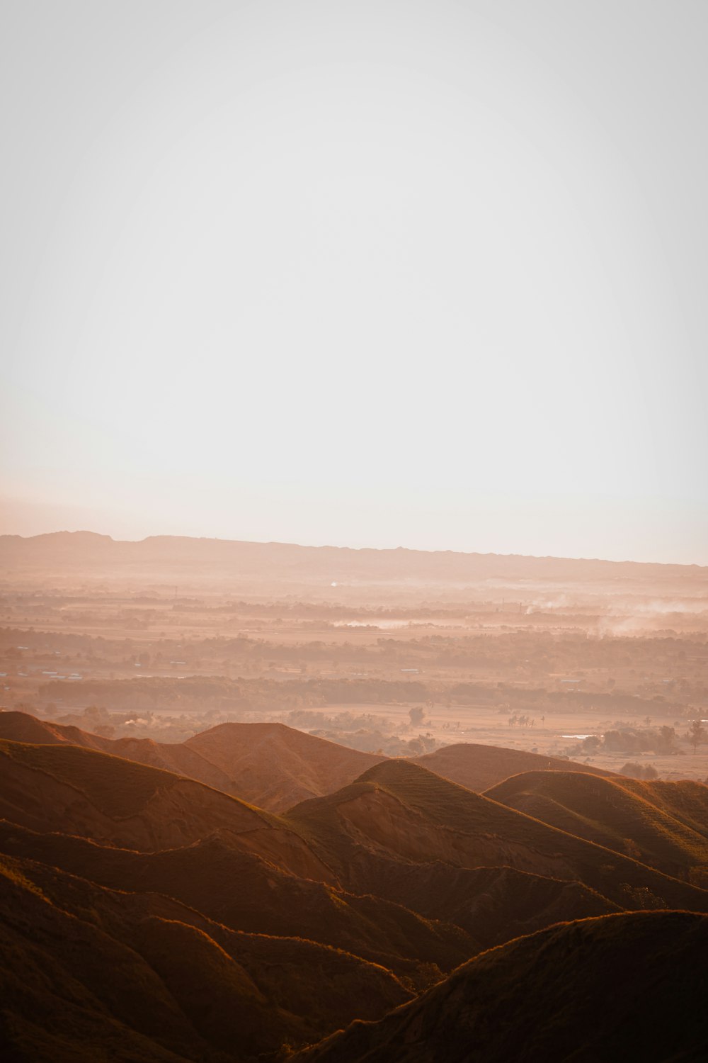 brown mountains under white sky during daytime