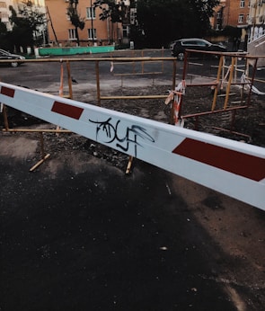Close-up of a sturdy cement barrier with reflective strips at a roadwork zone in Dubai