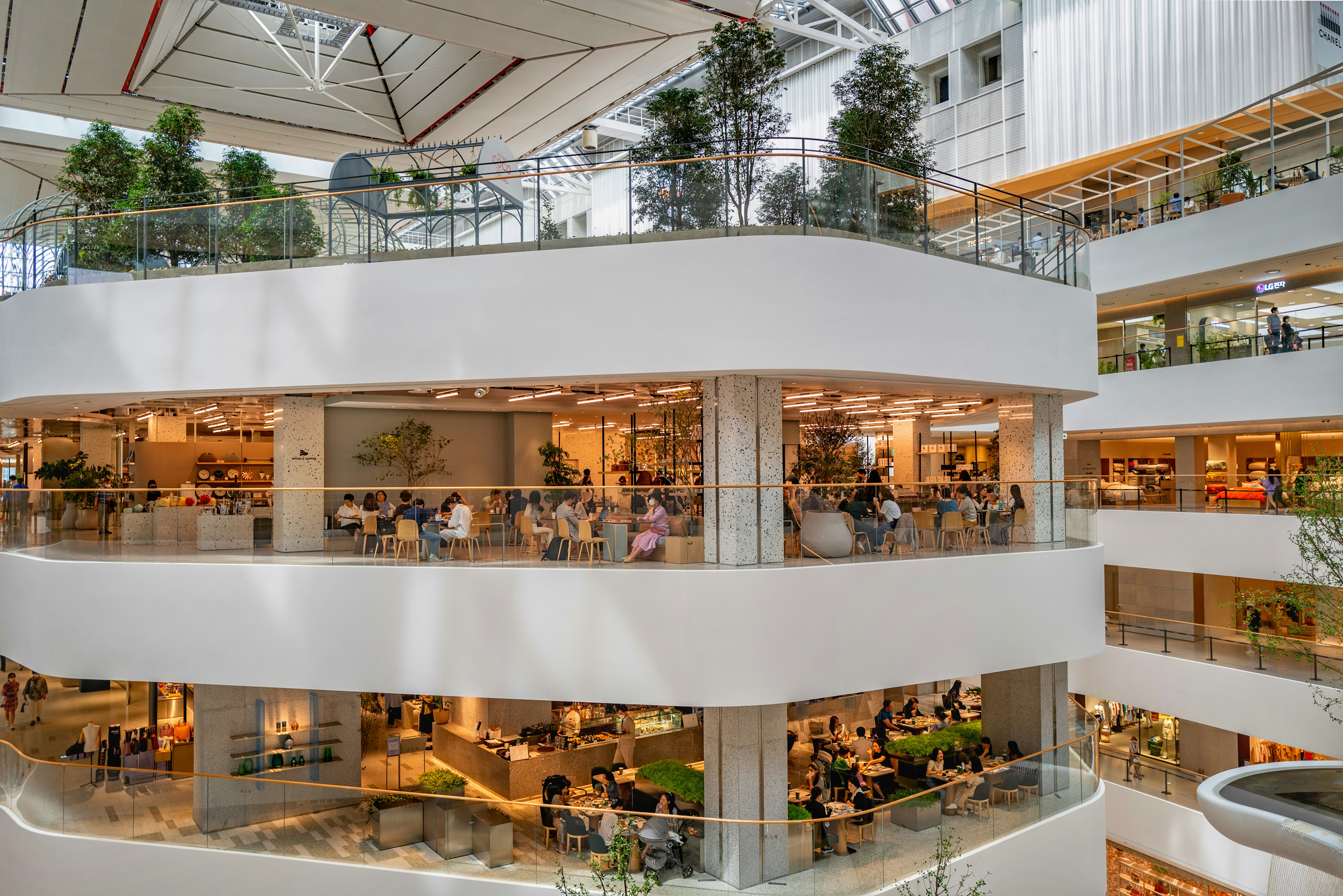 people walking on white concrete building during daytime, 