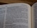 A close-up image of an open book, showcasing a section of text on biblical history involving kings and events. The page numbers and some headings are visible, emphasizing the context of the Old Testament.
