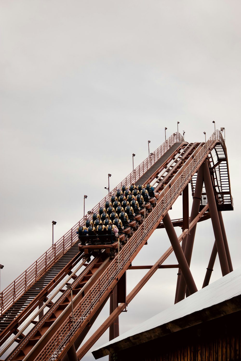 brown metal bridge under white sky during daytime