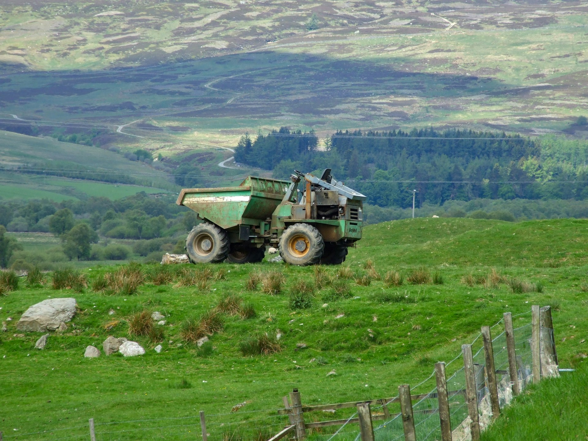woman wearing yellow long-sleeved dress under white clouds and blue sky during daytime