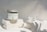 A serene spa setting showcasing argiléa products on a wooden table.
