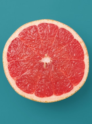 sliced orange fruit on blue background