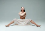 woman in white dress sitting on white floor