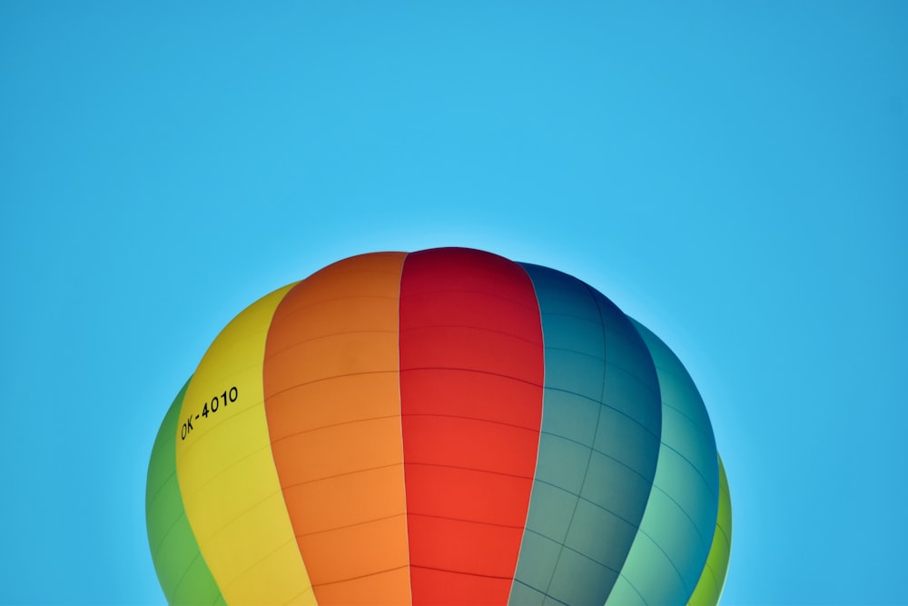 a colorful hot air balloon flying in the sky