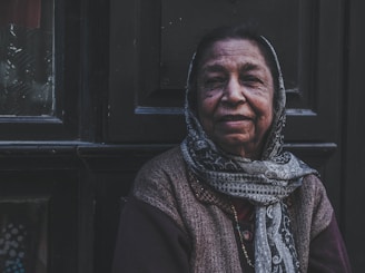woman in gray and black scarf