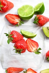 sliced strawberries on white ceramic plate