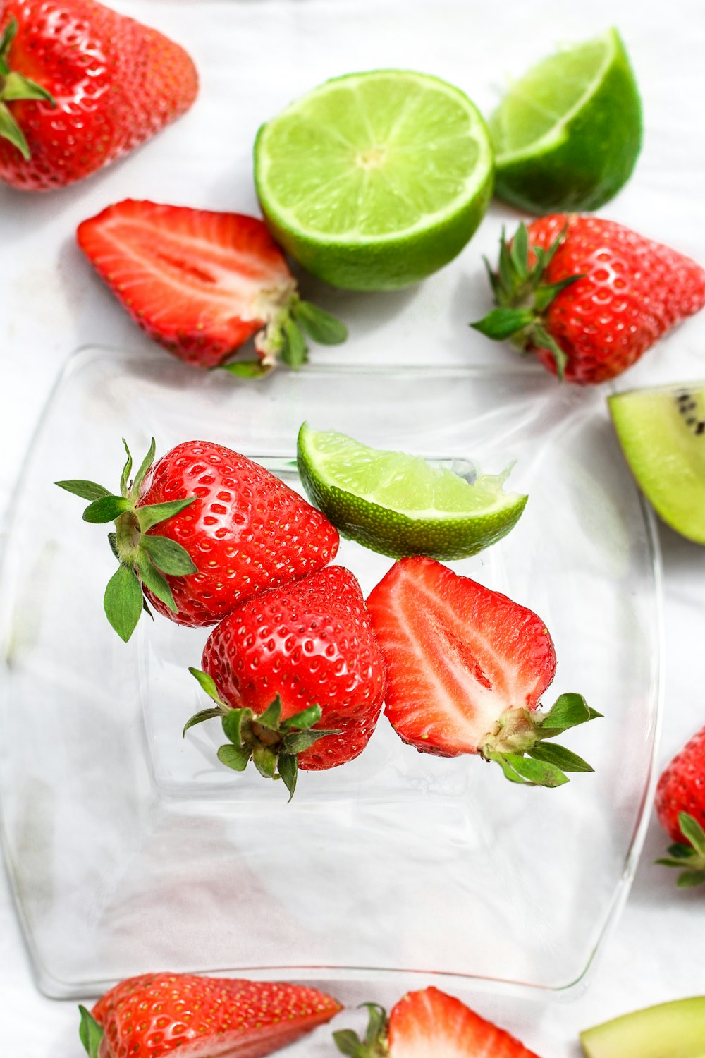 sliced strawberries on white ceramic plate