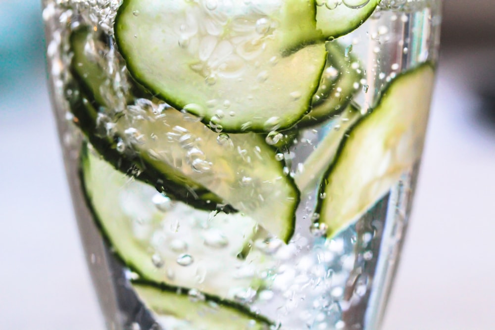 green vegetable on clear glass container