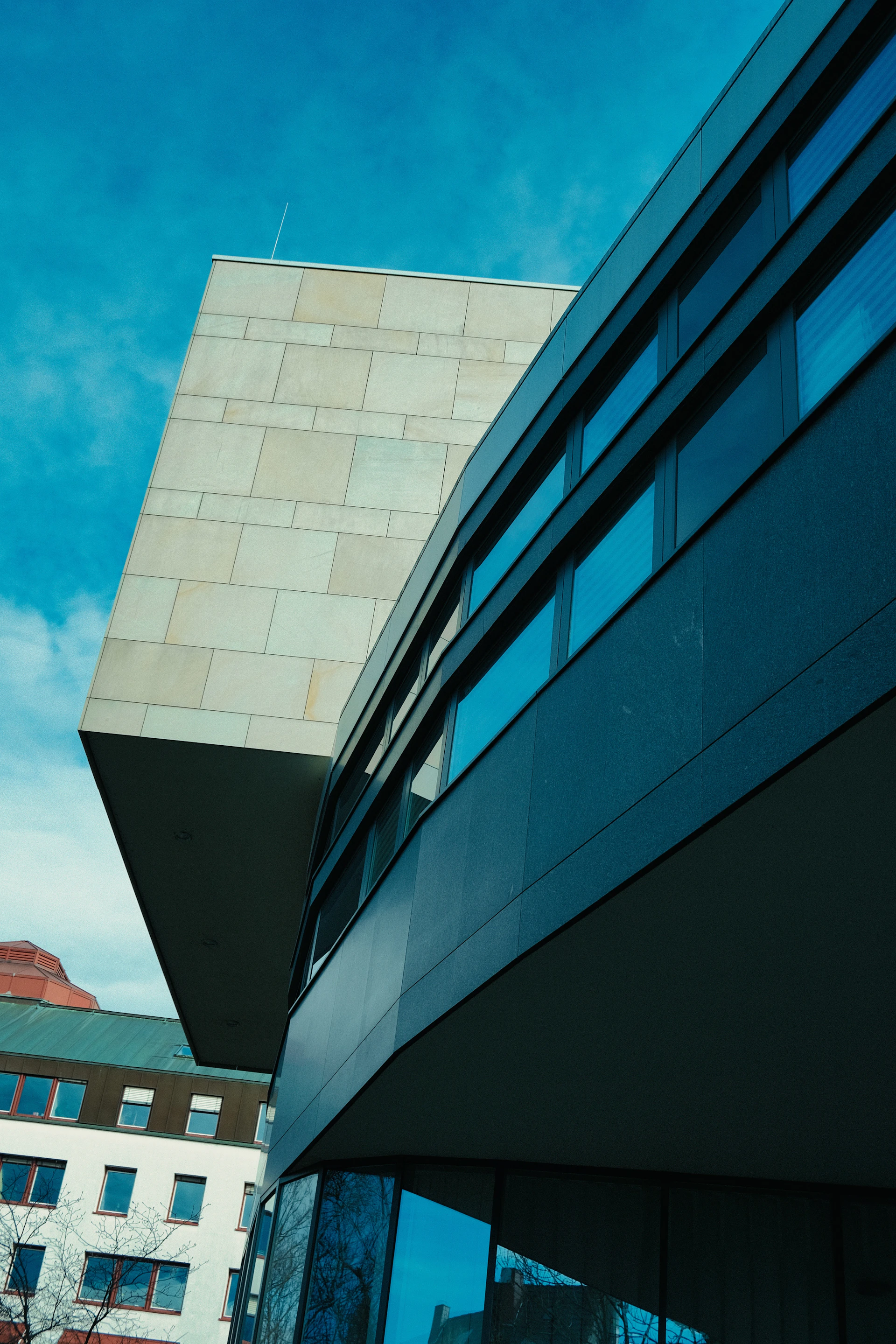 black and white concrete building under blue sky during daytime