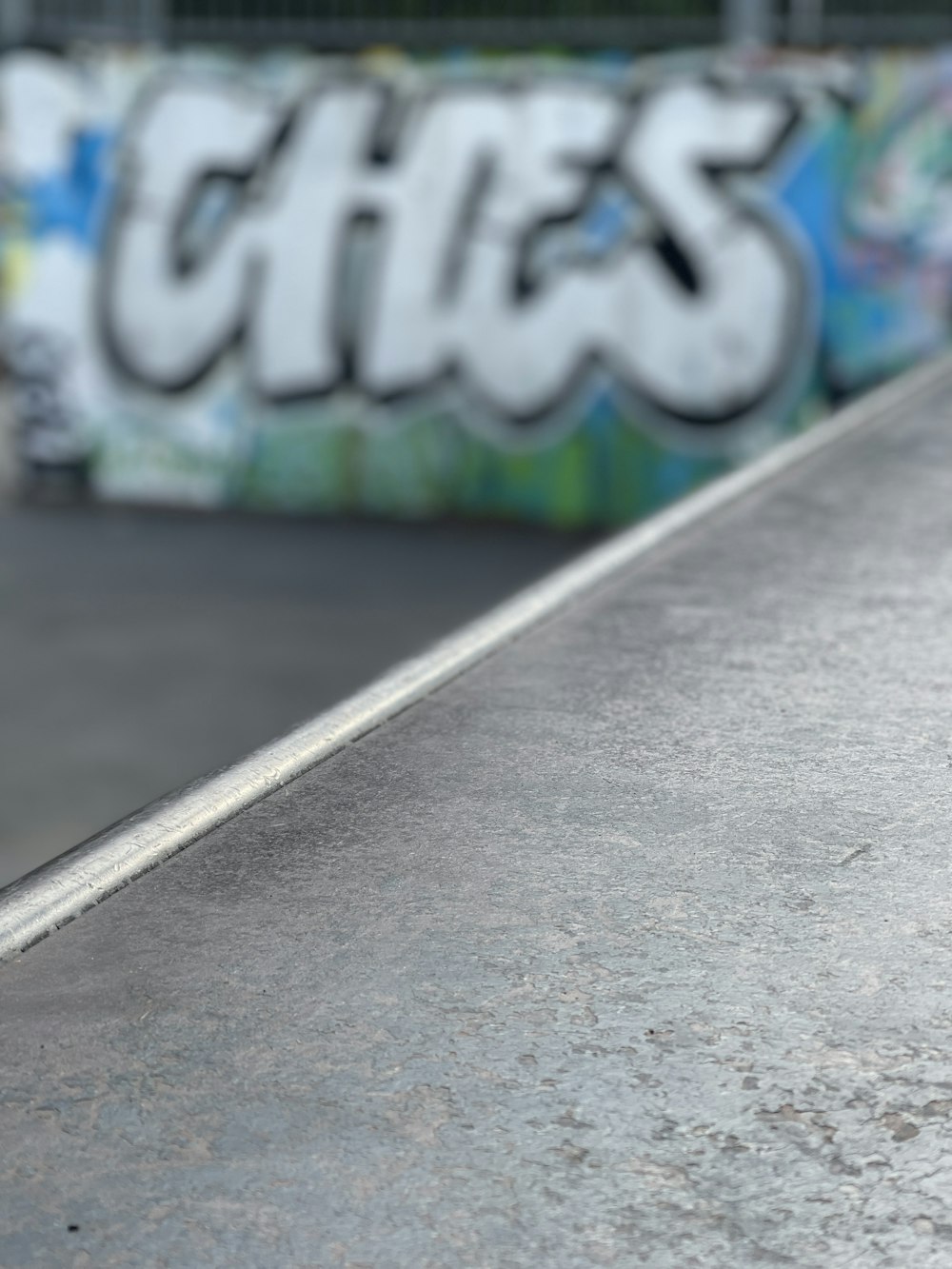 white and blue graffiti on wall