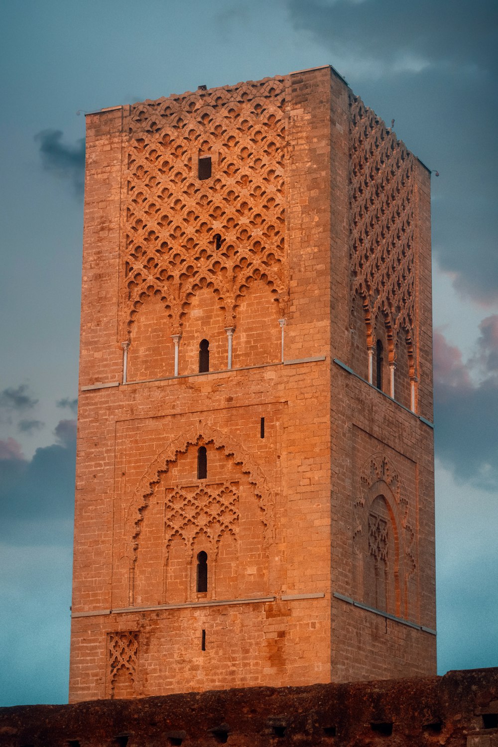 brown brick building under blue sky