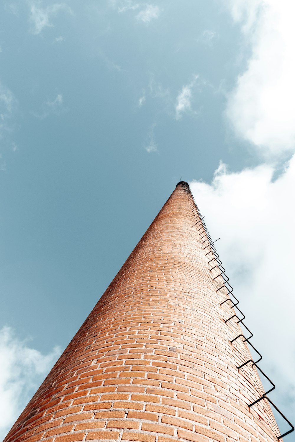 brown and gray concrete building under blue sky during daytime