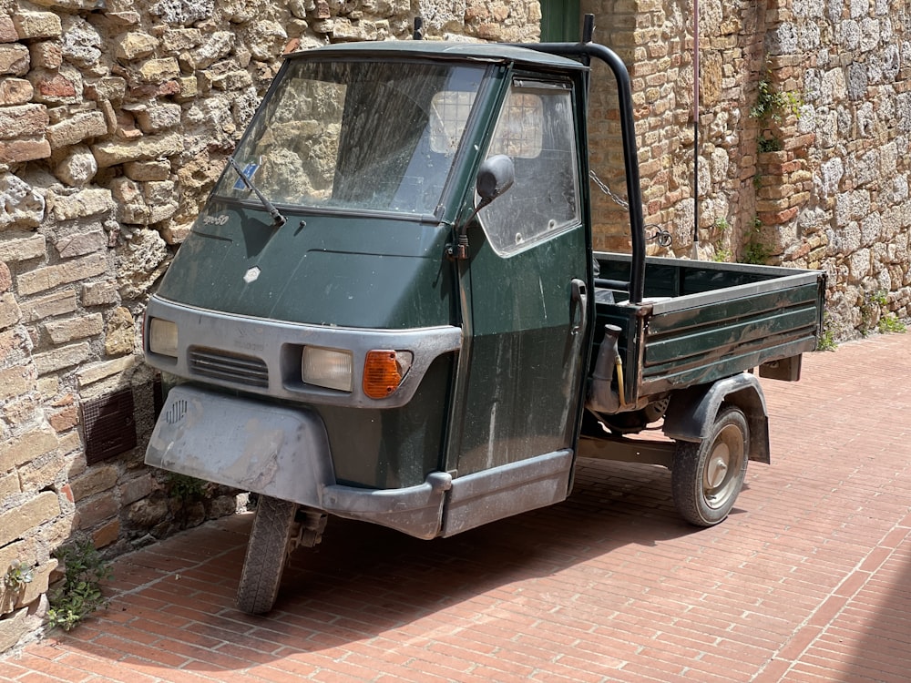 green and white single cab pickup truck