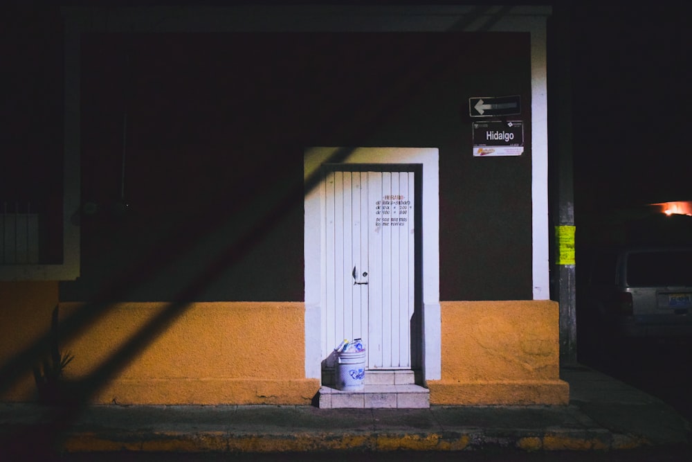 white wooden door closed during daytime