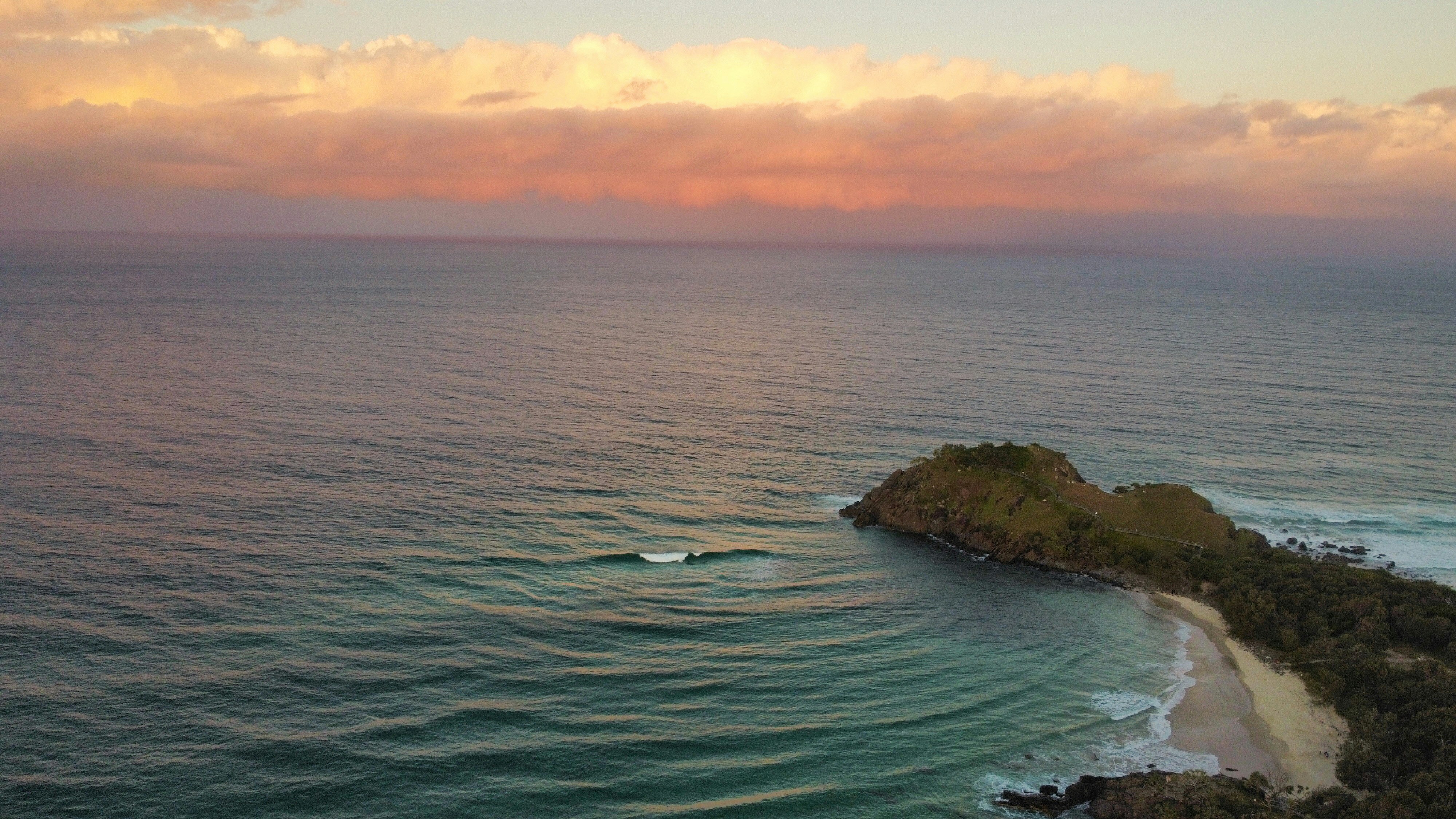body of water during sunset