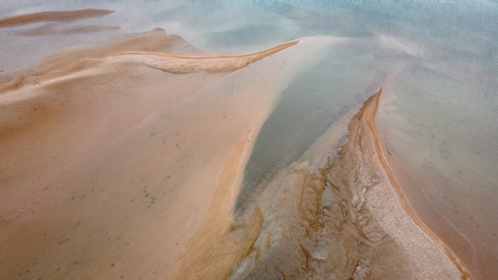 brown and white sand beach