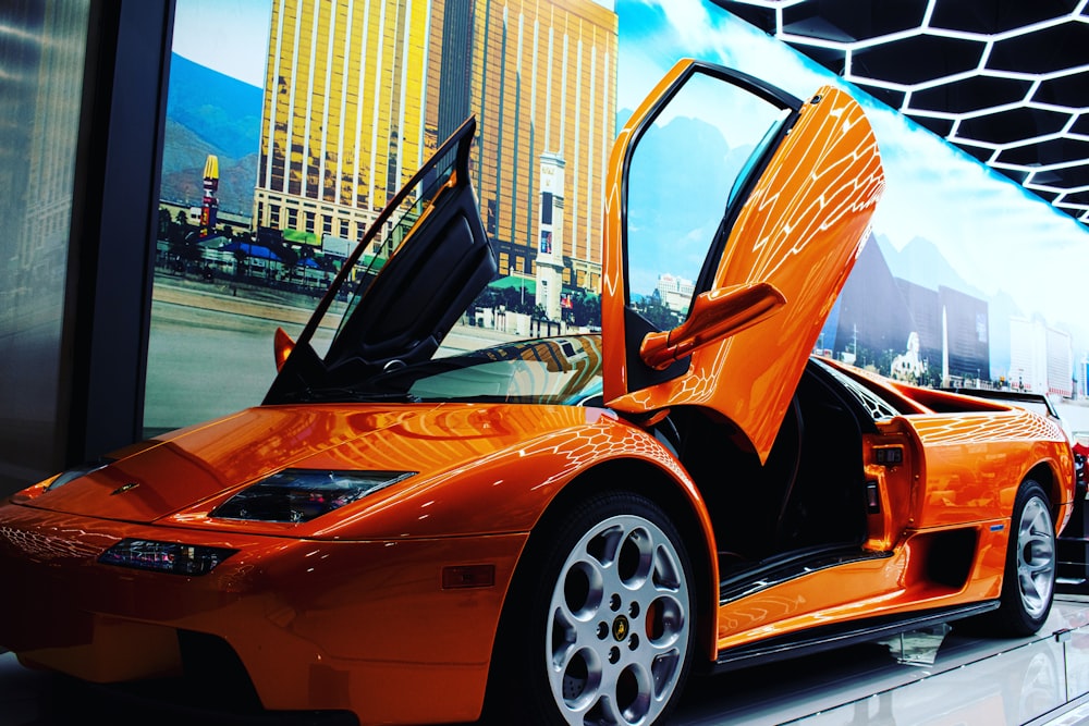 orange ferrari 458 italia parked on parking lot during daytime