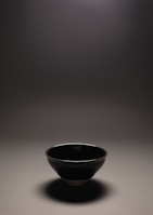 Elegant Orissa pan in pristine white, set on a polished stone floor with soft shadows.