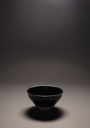 Elegant Orissa pan in pristine white, set on a polished stone floor with soft shadows.