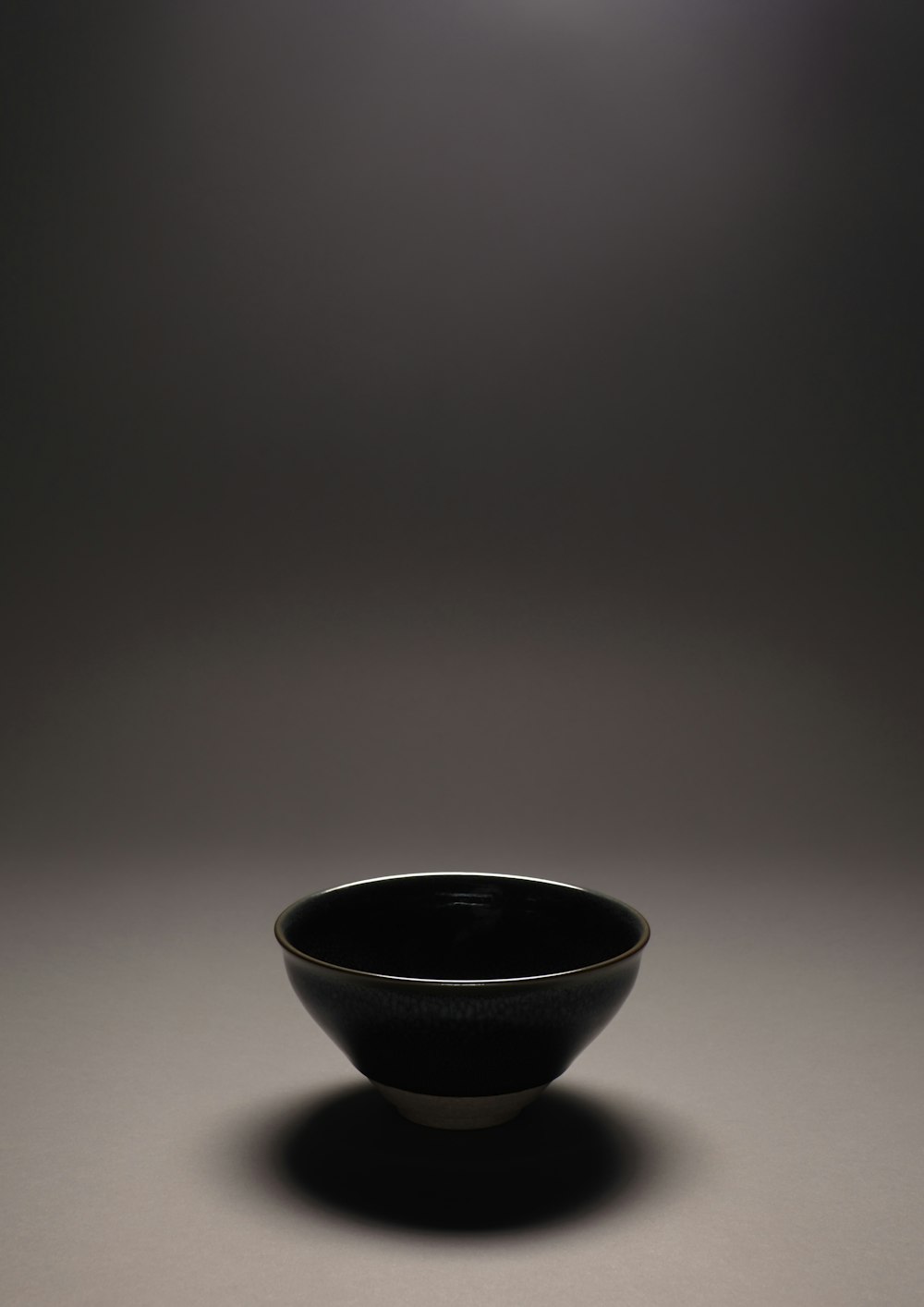 black ceramic bowl on white table