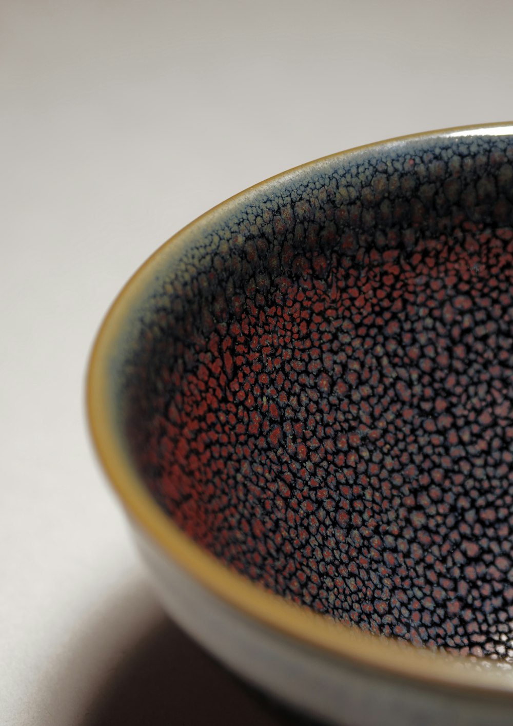 brown and black ceramic bowl